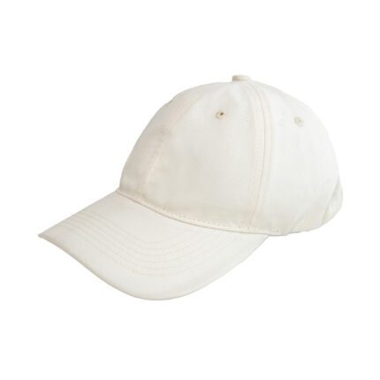 Side view of soft cream elastic cap showing smooth fabric texture and flexible structure